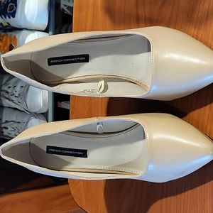 Beige high heel pumps